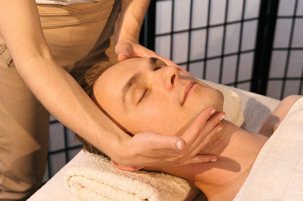 pexels photo 4599432 A serene massage setting with a man receiving facial relaxation therapy for ultimate stress relief.